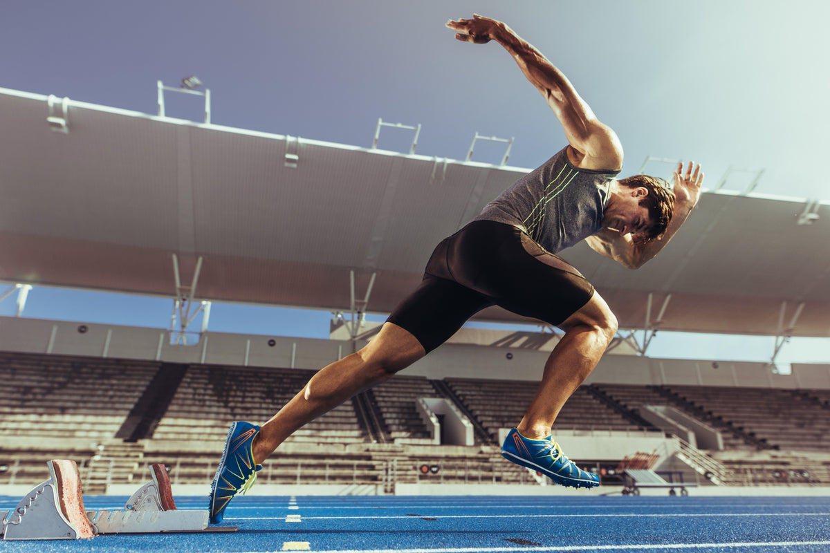 Fototapeta Sprinter Wybiegający Z Bloku Startowego – wzór