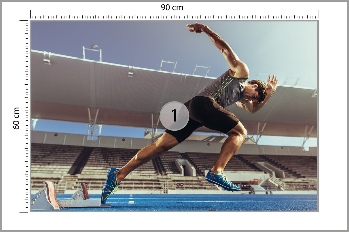 Fototapeta Sprinter Wybiegający Z Bloku Startowego 90 × 60 cm – podgląd kadru