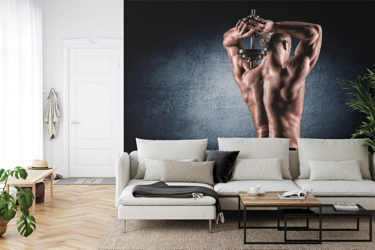 Fototapeta Umięśniony Mężczyzna Z Hantlem – aranżacja wnętrza