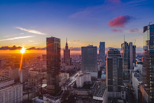 Obraz Na Płótnie Zachód Słońca w Warszawie – miejski pejzaż w ciepłych barwach do wnętrz nowoczesnych i urban modern 120x80