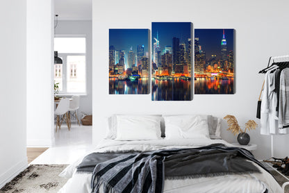 Obraz Wieloczęściowy Manhattan Nocą – dynamiczny blask do wnętrz nowoczesnych, industrialnych i glamour – widok 6