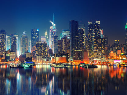 Obraz Wieloczęściowy Manhattan Nocą – dynamiczna panorama miejska do wnętrz nowoczesnych i industrialnych 200x150