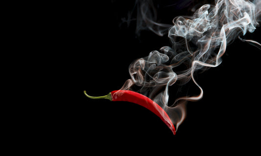 Obraz Wieloczęściowy Czerwone Chili z Dymem – ekspresyjny akcent do wnętrz loftowych i nowoczesnych 250x150